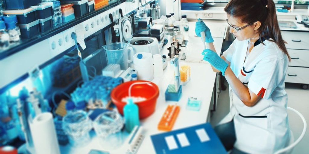 a person maintaining their lab equipment.